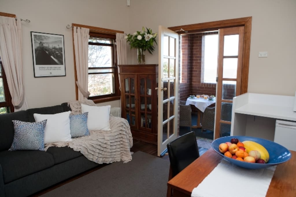 Lounge room leading onto private balcony with views of Manly Beach