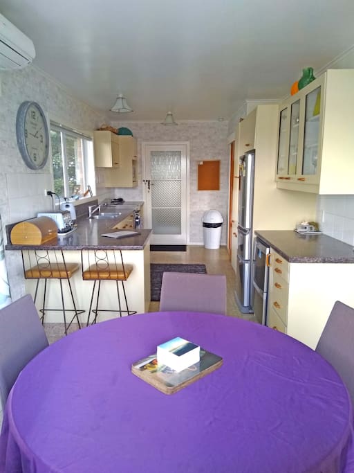 Kitchen with new stainless appliances and heatpump