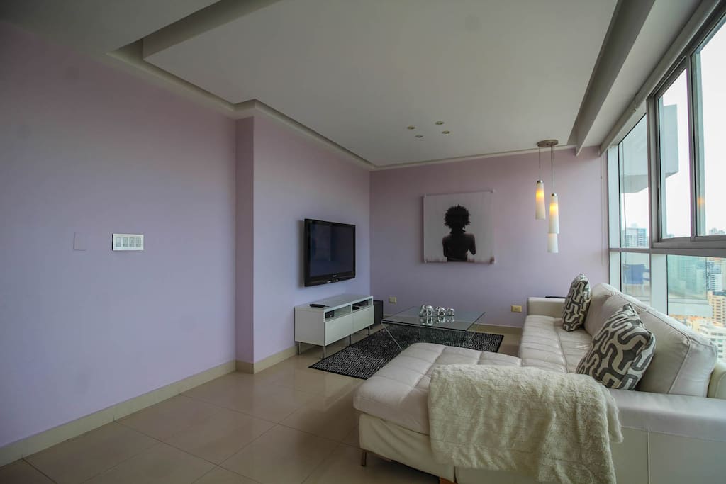 Featuring a cozy leather sofa, 50 inch plasma tv, Bose system, and Apple TV.