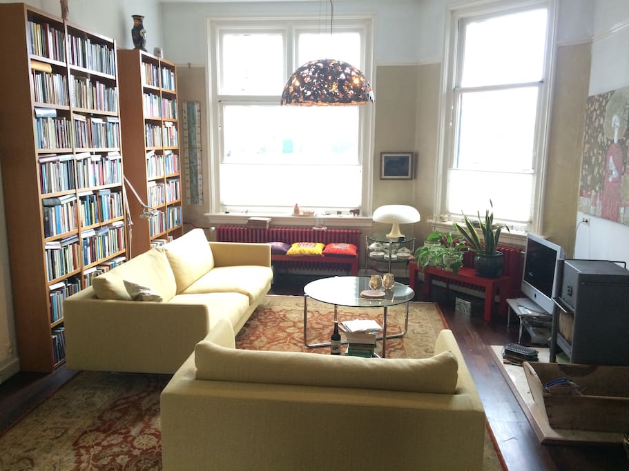 Other side of living room with TV, including Apple TV, and comfortable couches