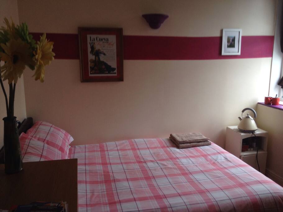 Double bedroom with wardrobe and chest of drawers space. Toiletries if required. Electric kettle with a selection of different teas and coffee. TV.