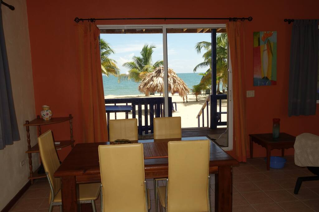 Dining table with doorway to veranda and ocean