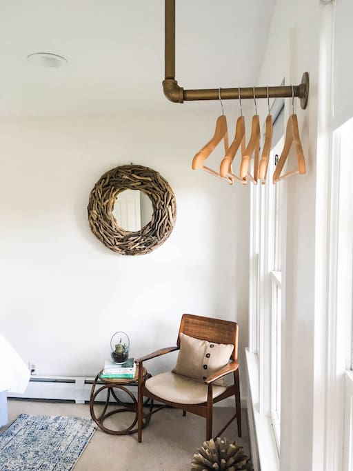 Bright reading nook and retro clothing rack