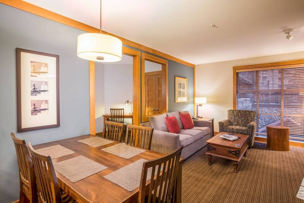 Take a seat at the dining room table and keep the cook company.