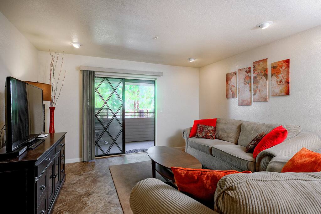 Seating for 5 in the living area with plush sofa and matching loveseat.