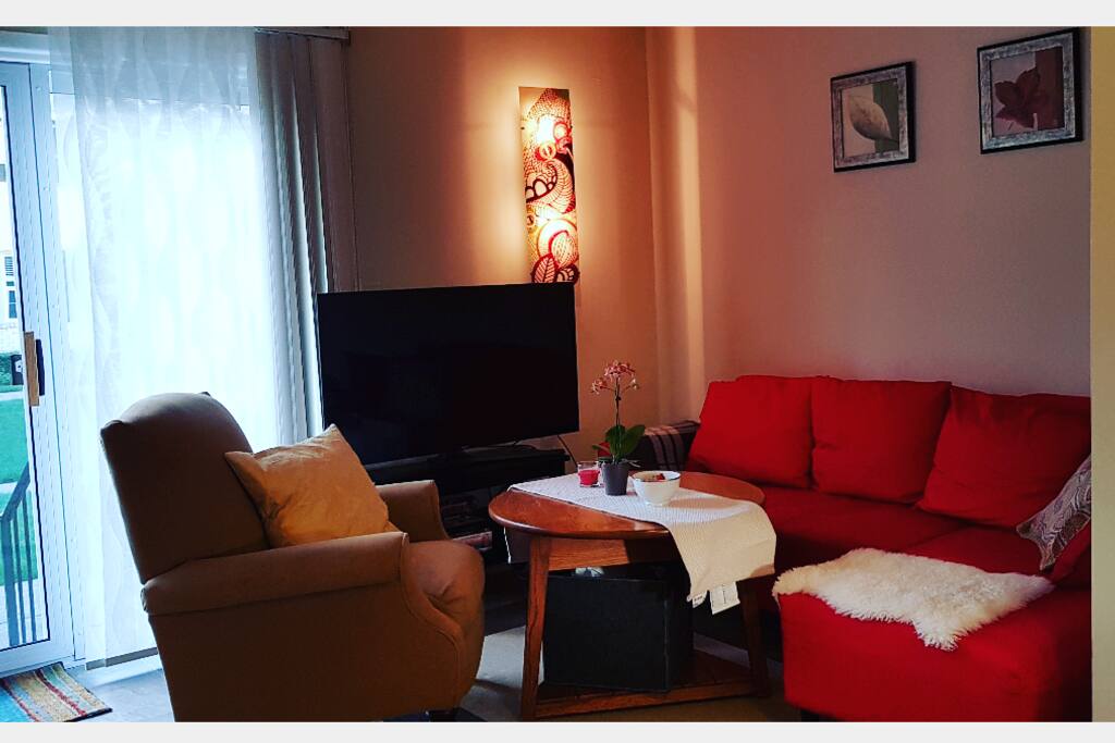 Cozy corner with sofa, recliner and TV