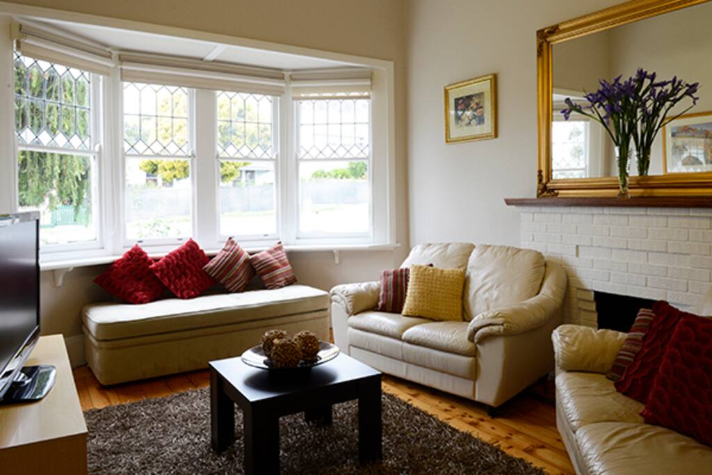 The lounge room is bright and snug with TV, DVD & Pay TV