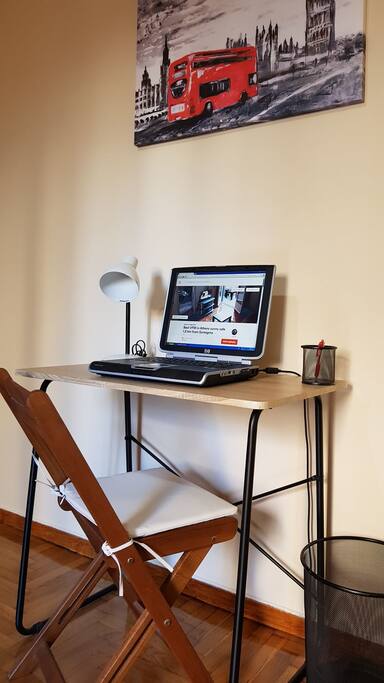 Desk with laptop free to use and chair
