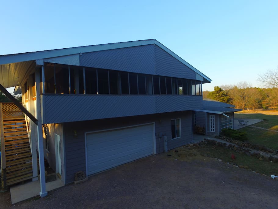Enjoy the view from the fully screened in porch overlooking the forest, with private entrance.