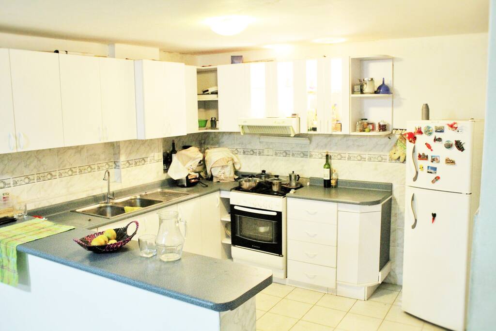 The kitchen, some Olive oil and Wine