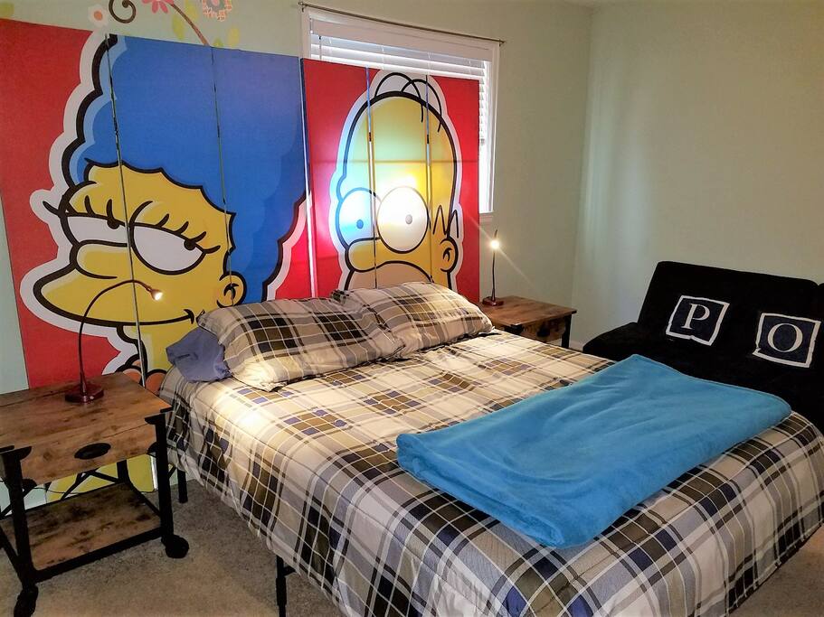 There's plenty of space in the master bedroom with its queen-size bed, if you're sharing. If you're not, the futon along the wall opens into a full-size bed.