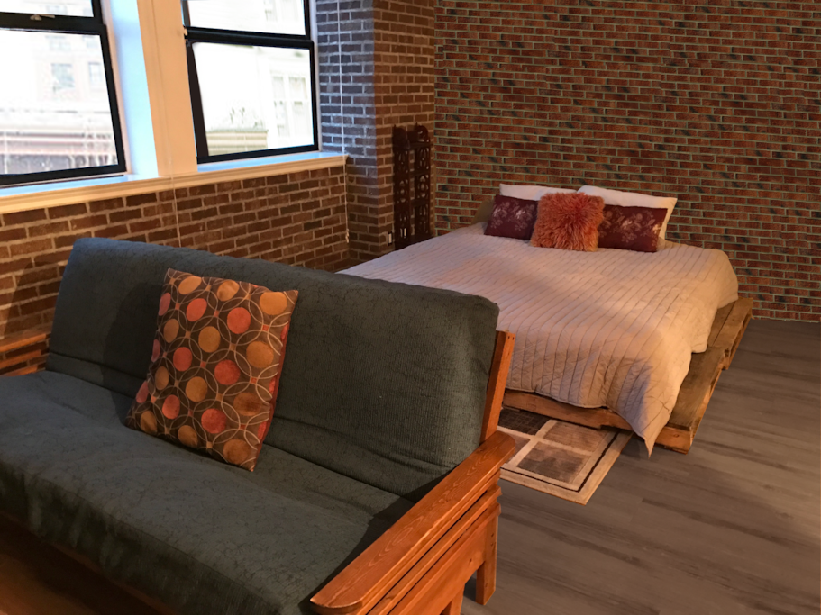 Giant king size bed for a good night's sleep, fold out double bed for friends and kids, amongst an industrial design