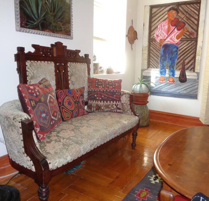 Large living room with high ceilings and ceiling fan