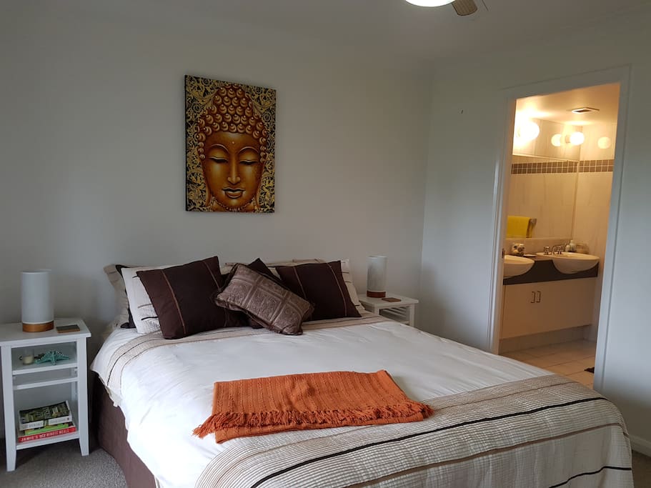 Beautiful Queen bedroom steps outside to garden