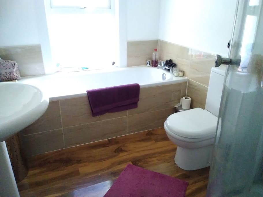 Large bathroom with separate shower