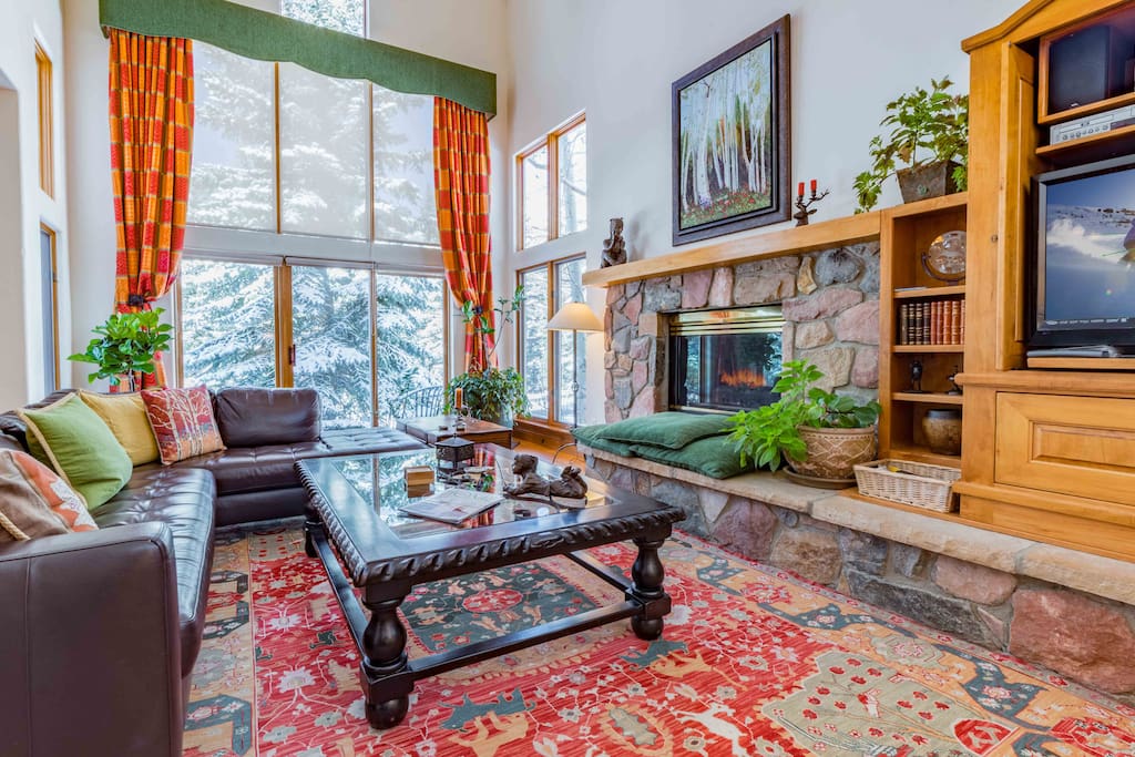 Beautiful, inviting open concept living room with cozy gas fireplace