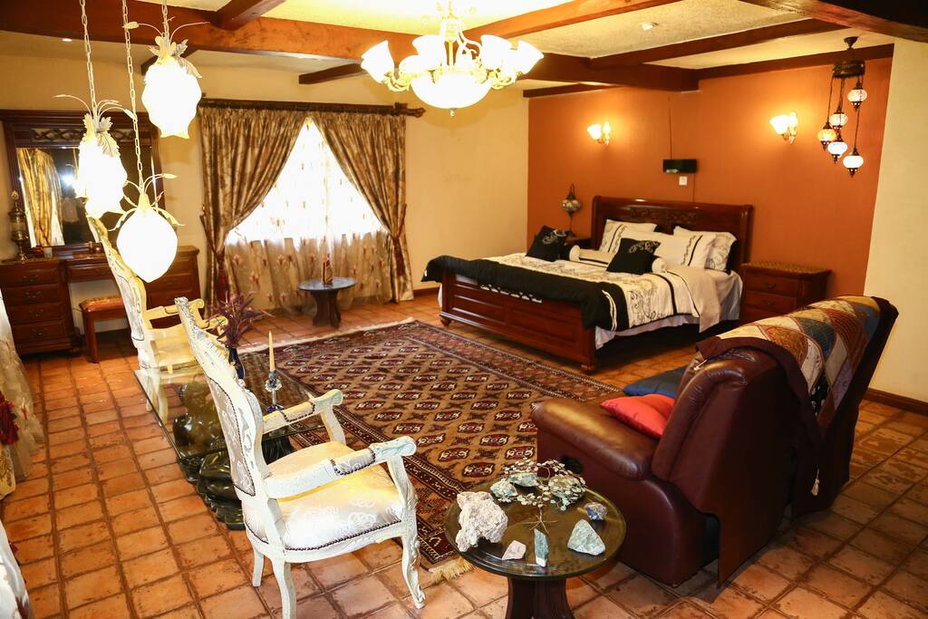 A tastefully furnished master bedroom fit for royalty