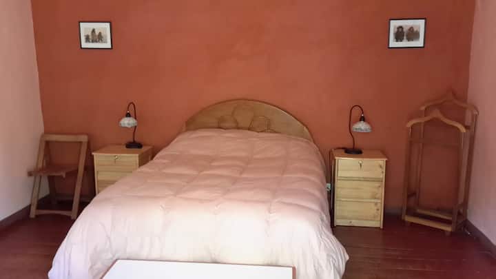 Comfortable bedroom with natural clay finish.