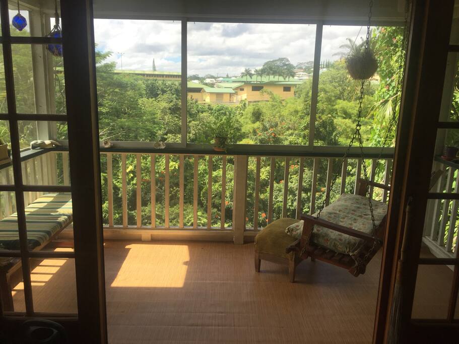 Back Lanai with porch swing. Perfect place to relax