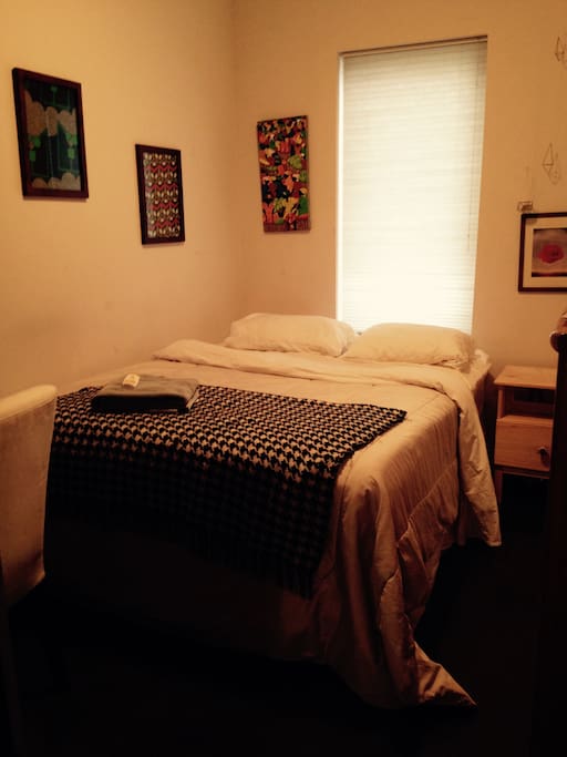 Room available. Comfy queen-sized bed, ceiling fan, and sunny window