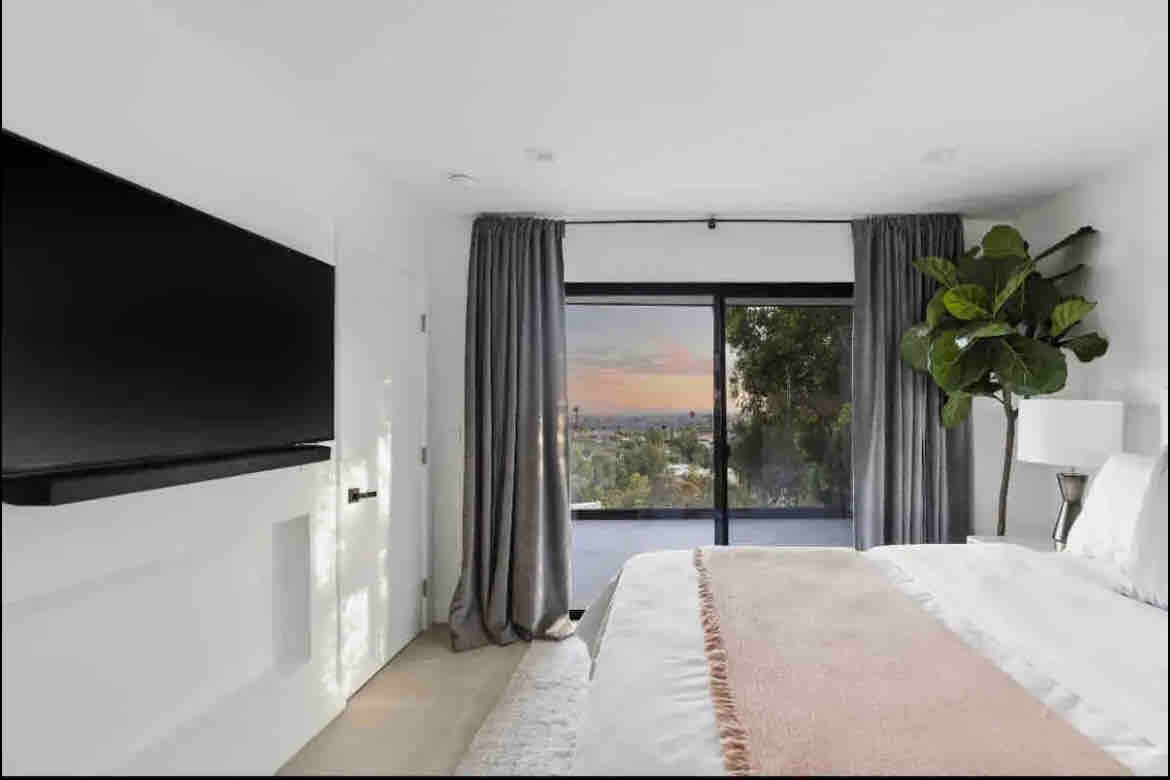 Upstairs room has queen sized bed with direct access to balcony & bathroom 