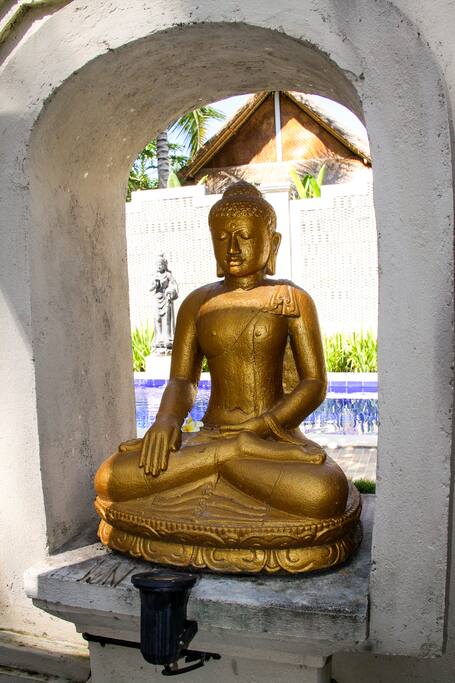 Buddha welcomes our guests with Dewi, the Indonesian Rice Goddess in the back.