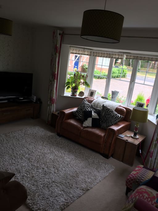 Large living room with Sky TV, Apple TV and Now TV