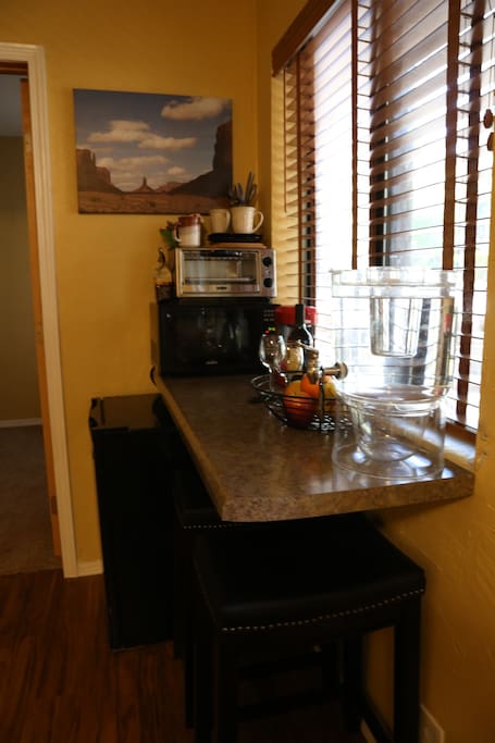 Kitchenette with complimentary wine, mini fridge, microwave, toaster, coffee/keurig/tea maker, tableware, and water dispenser filled with local Sedona spring water.