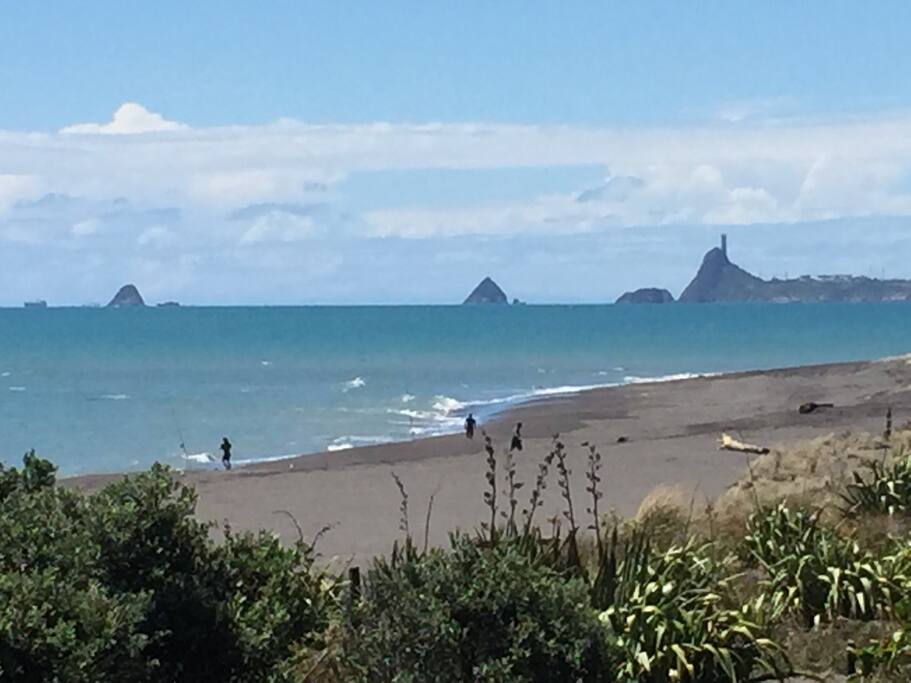 Caravan on 45 view of fisherman on ahu ahu beach, looking towards New Plymouth