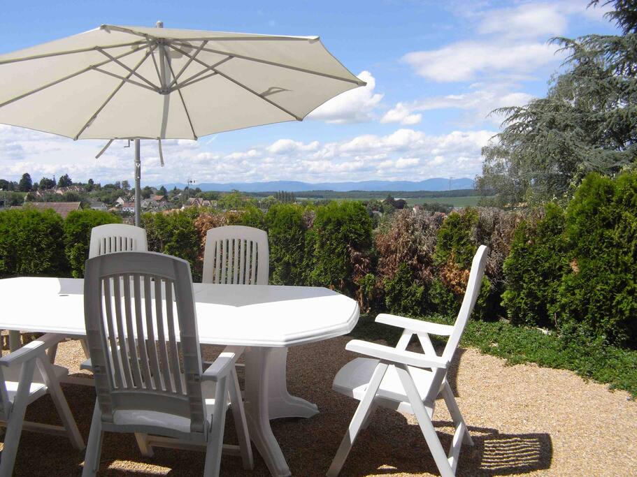 Breakfast place outside with view on the Vosges mountains.