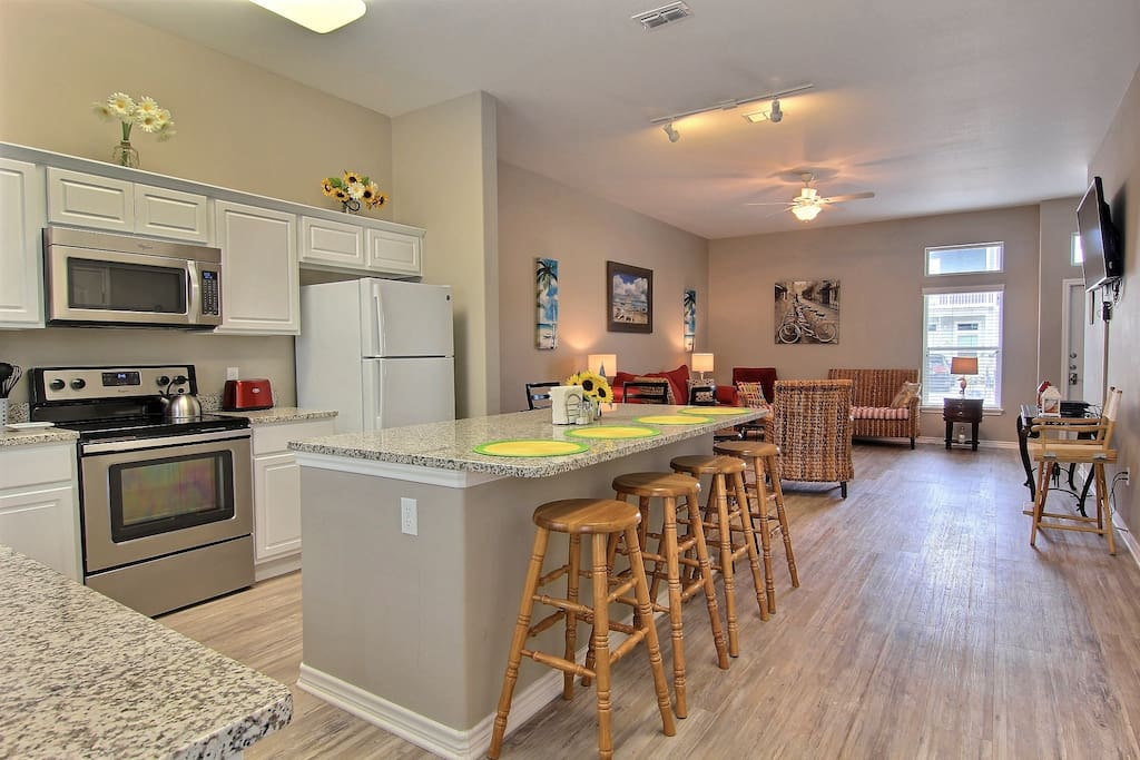 Full kitchen and living room. Plates, utensils,glasses, pots,pans, etc. Full size washer and dryer.
