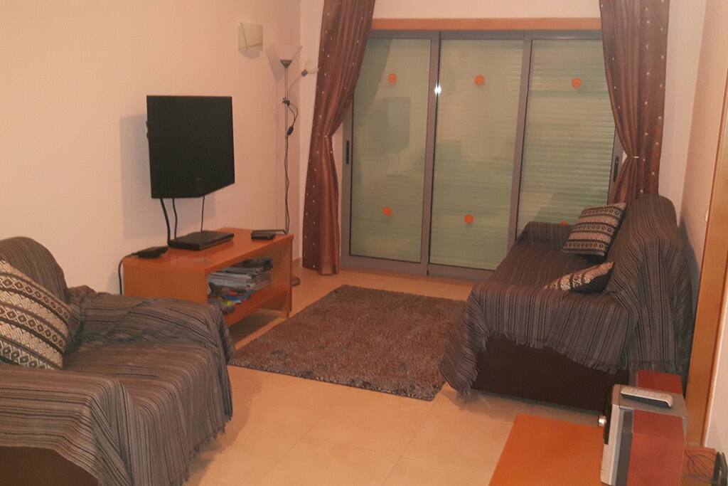 Lounge with patio door access to long balcony