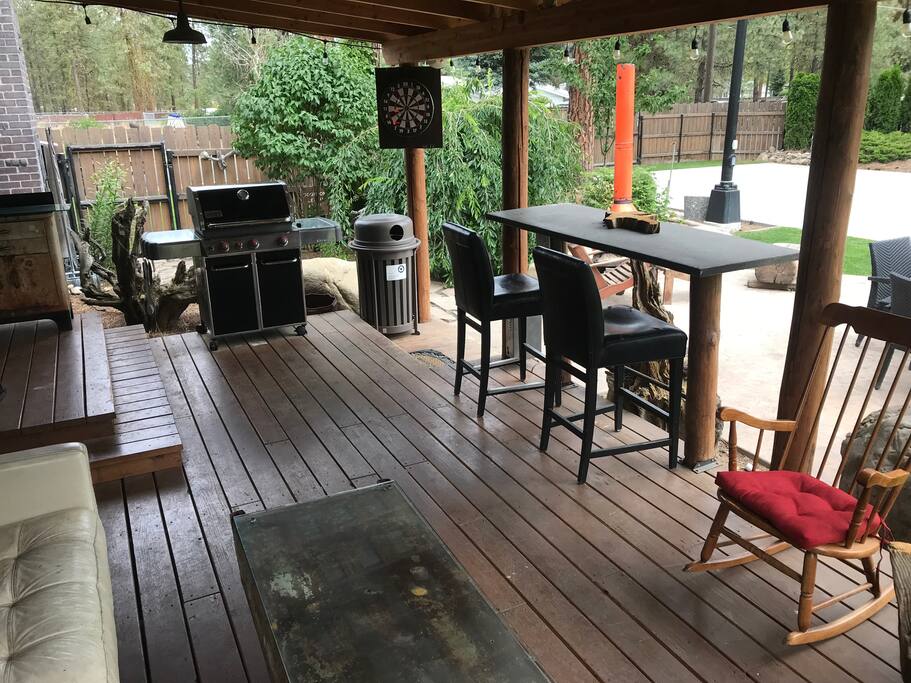 Covered porch with Weber grill.