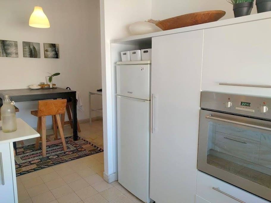 Kitchen with built in stove and oven, a second larger fridge is available
