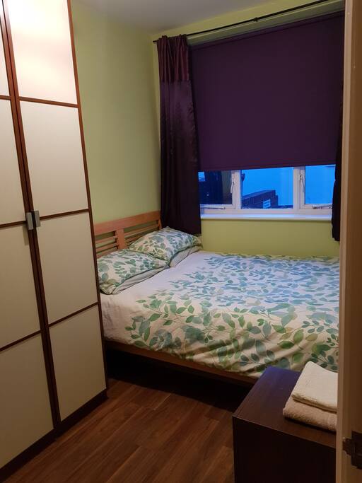Main bedroom with double bed plus wardrobe and storage.