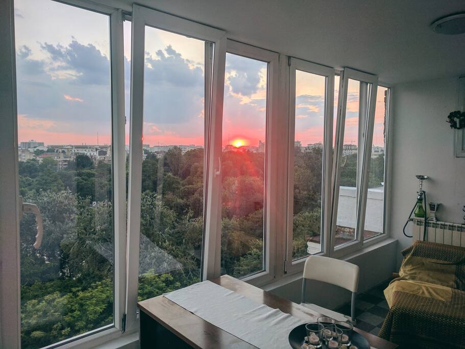 View of sunset on the Cismigiu park from the veranda