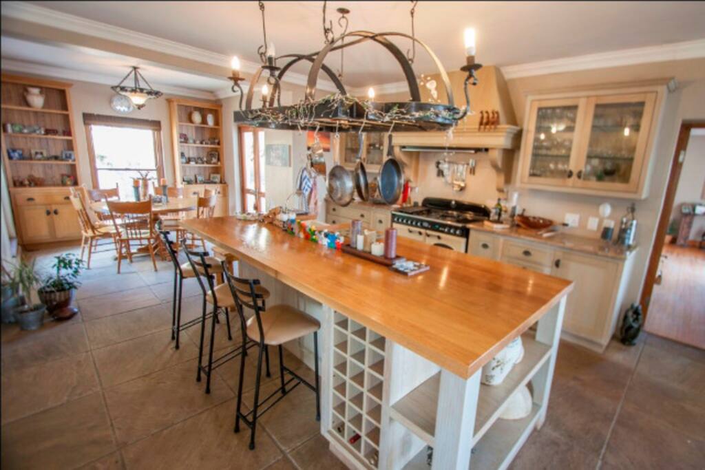 Open plan extensive kitchen with large double fridge and gas stove. Granite counters and 3 seating options..