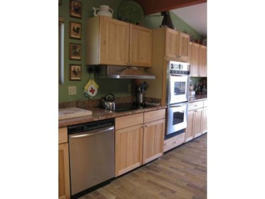 Full and open kitchen with double ovens. Well stocked with all utensils, plates, pots, pans, Ninja blender - you will find what you need to prepare pretty much anything