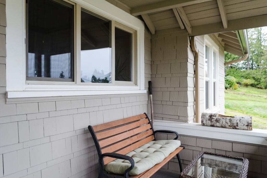 A little bench to watch sunrises and sunsets sits on the front porch