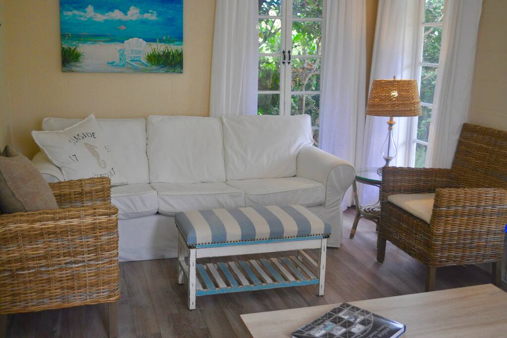 Comfortable couch and plenty of seating in the living room.