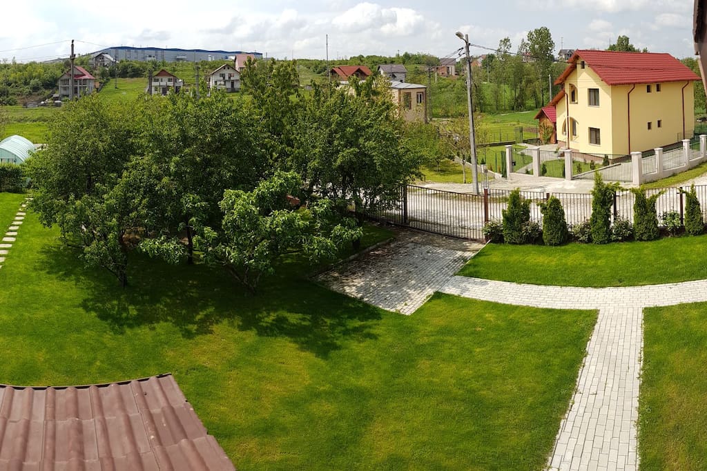 Balcony view of the yard and parking place
