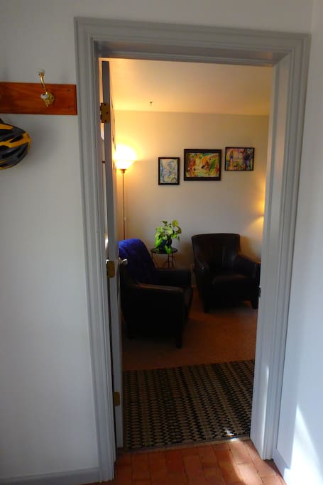 Separate doorway from shared entranceway. Feel free to hang coats or leave shoes here, or keep them with you inside.