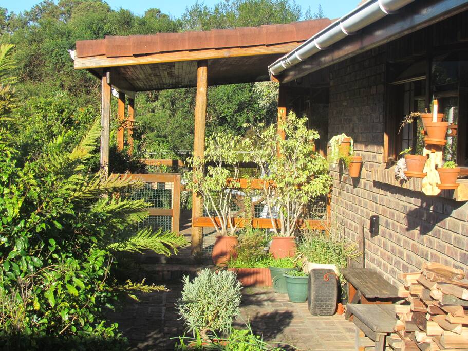 Private verandah with small barbecue, chairs and table