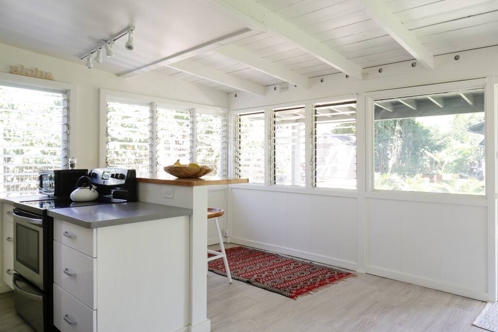 New fully-stocked kitchen with custom-made counter.
