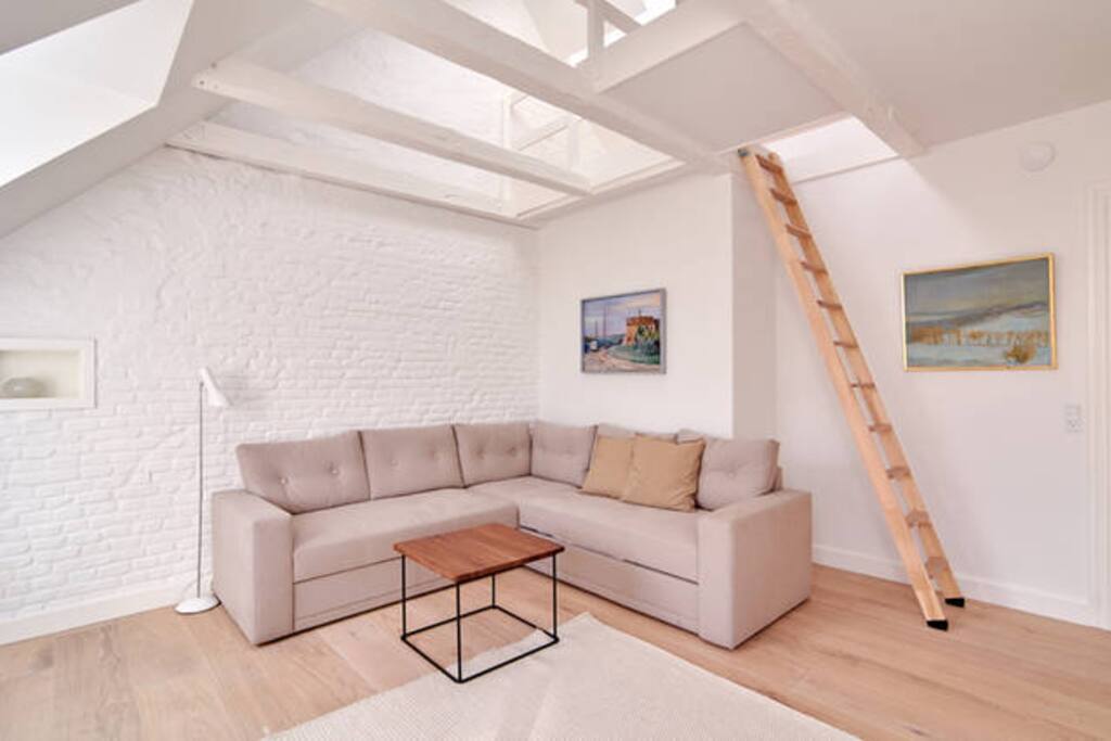 Very cool Nordic/ New Yorker style. This is the 2nd duplex which is 50m2. Beds upstairs. Sofa can be converted to bed