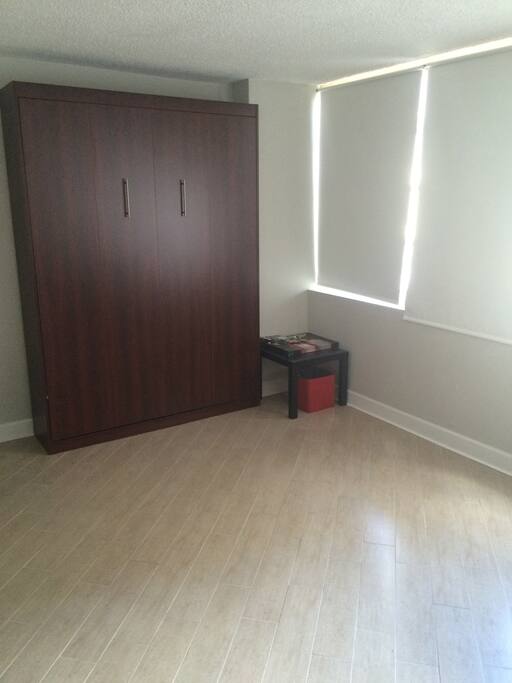 Murphy bed closed. It gives the apartment more space for you to enjoy more company