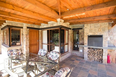 Modern stone apartments set under old Oak Tree
