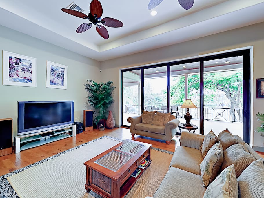 The seating faces the 60” cable TV in the living room.