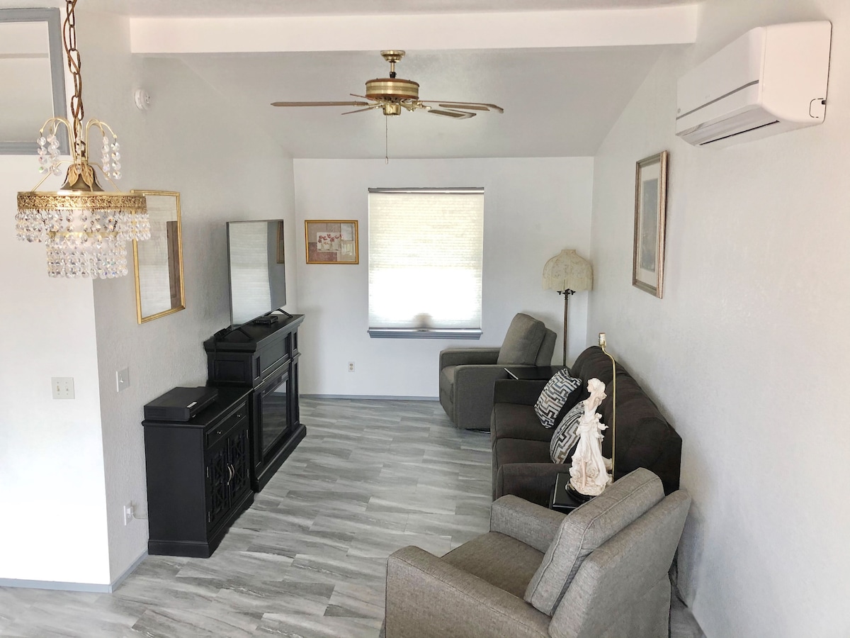 Relax on the comfy sofa or enjoy the two swivel/rocker/recliner chairs while you catch a movie or show on the big screen TV.  