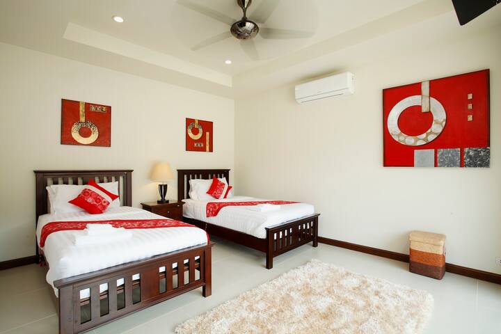 Bedroom 5 with 2 x single beds, air conditioning and ceiling fan
